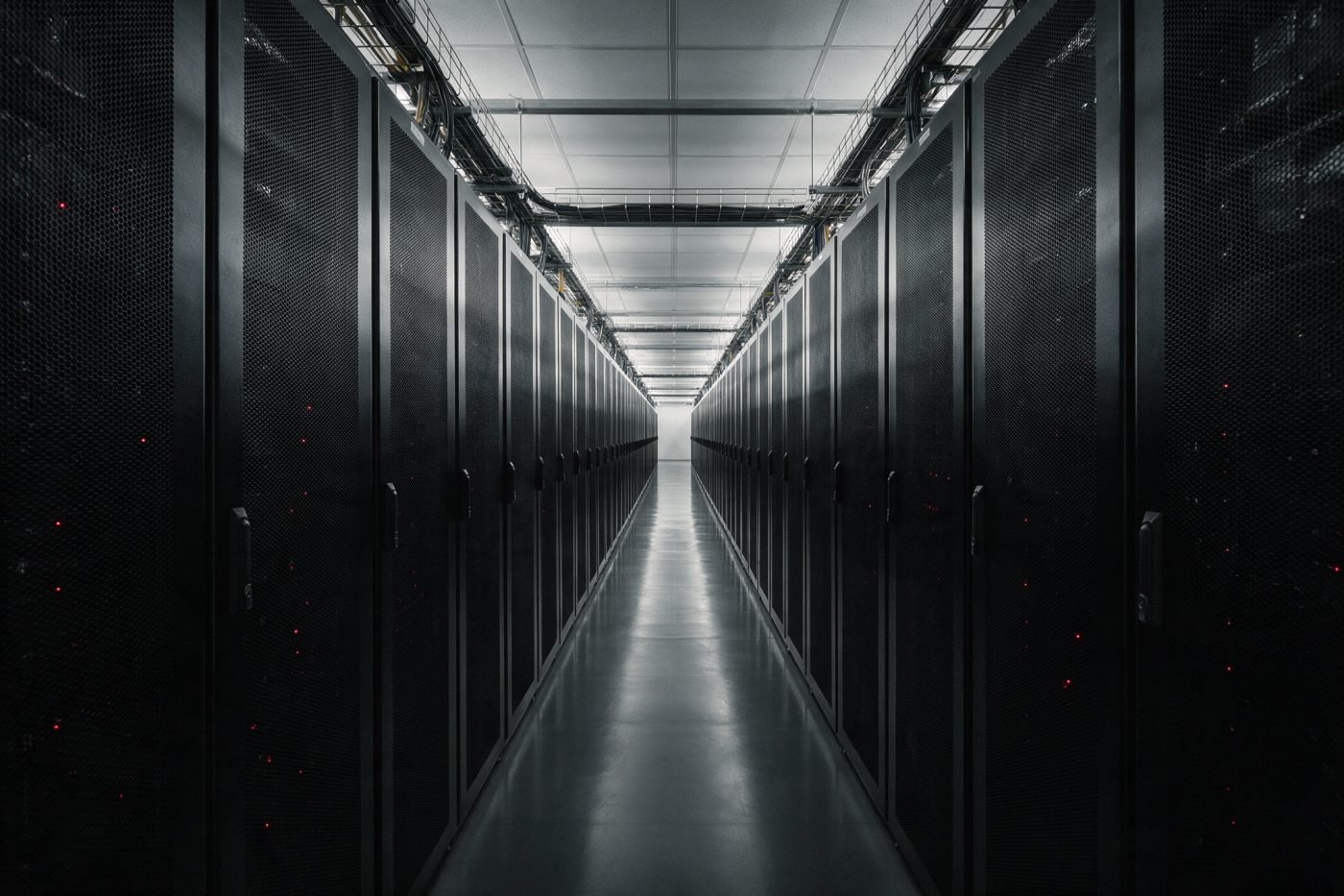 Datacenter cold aisle between rows of server cabinets